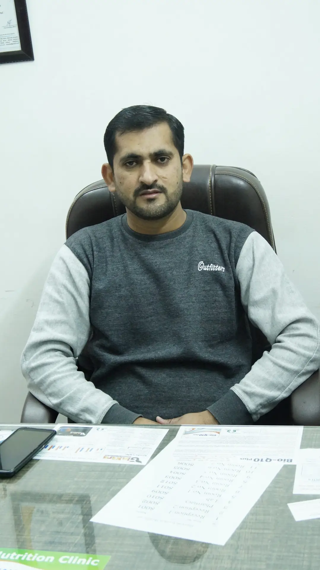 Dr. Ejaz Danish Neuro Physiotherapist in Lahore 3 a man sitting in a chair