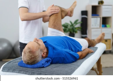 physiotherapist working elderly patient doing 260nw 515526961 1
